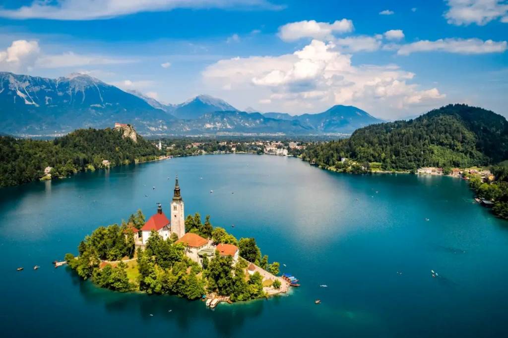 Aerial view of Lake Bled with island church and Julian Alps backdrop